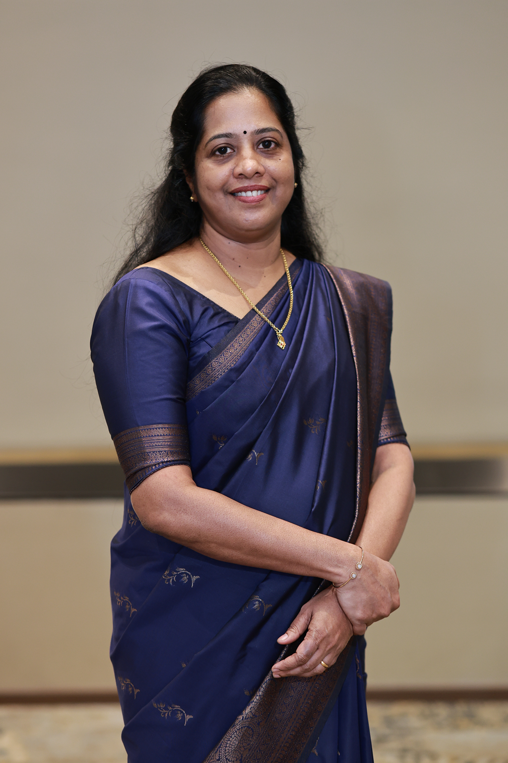 Headshot of Latha Sanjith – President, Client Services